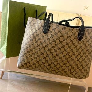 Gucci reversible GG tote black & tan interlocking GG pattern/Black on reverse.